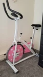 Sunny Health Fitness P8100 Chain Drive Indoor Exercise Bike - Pink. Fixed Price $100.00.